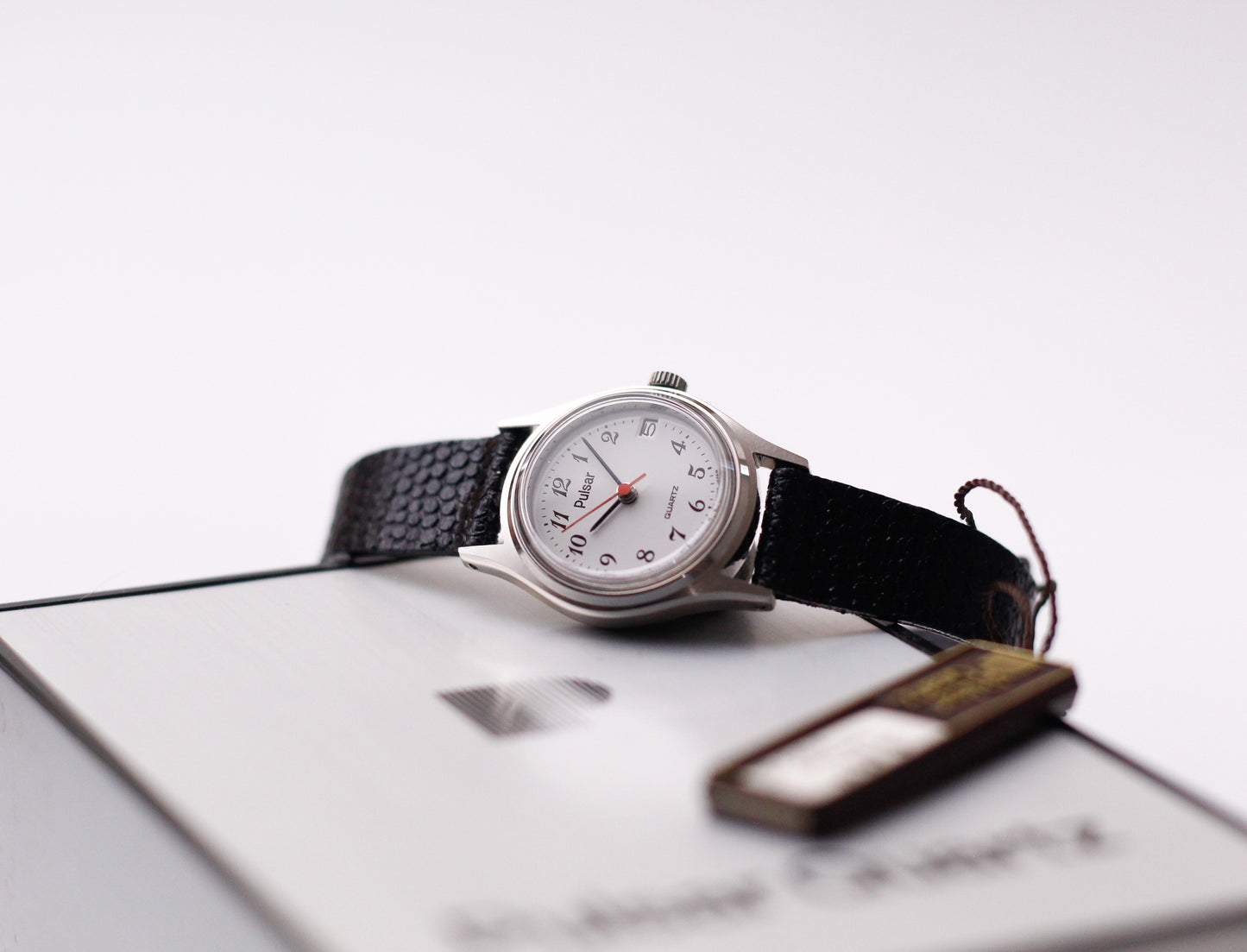 [New Old Stock]. 1986 Pulsar Quartz White Arabic Numeral Dial Ladies' Wrist-Watch W/Box & Tag